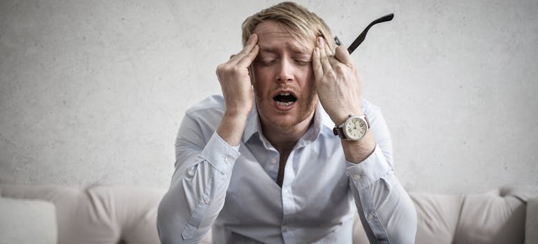 A stressed man thinking about stress anxiety and substance use connection